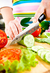 Image showing Woman's hands cutting vegetables