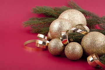 Image showing beautiful golden christmas decoration on red background