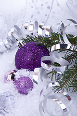 Image showing beautiful christmas decoration in purple and silver on white snow