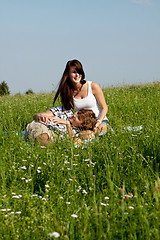 Image showing young couple outdoor in summer on blanket in love