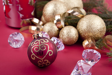 Image showing beautiful golden christmas decoration on red background