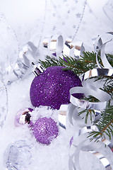 Image showing beautiful christmas decoration in purple and silver on white snow