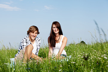 Image showing young couple outdoor in summer on blanket in love