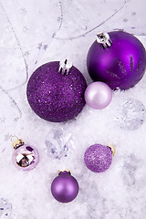 Image showing beautiful christmas decoration in purple and silver on white snow