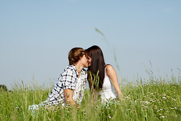 Image showing young couple outdoor in summer on blanket in love