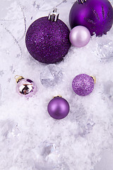 Image showing beautiful christmas decoration in purple and silver on white snow