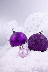 Image showing beautiful christmas decoration in purple and silver on white snow