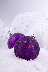 Image showing beautiful christmas decoration in purple and silver on white snow