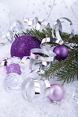 Image showing beautiful christmas decoration in purple and silver on white snow