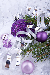 Image showing beautiful christmas decoration in purple and silver on white snow