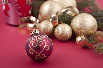 Image showing beautiful golden christmas decoration on red background