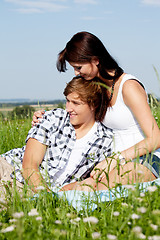 Image showing young couple outdoor in summer on blanket in love