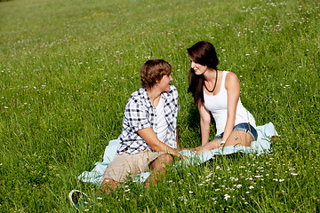 Image showing young couple outdoor in summer on blanket in love