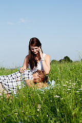 Image showing young couple outdoor in summer on blanket in love