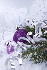 Image showing beautiful christmas decoration in purple and silver on white snow