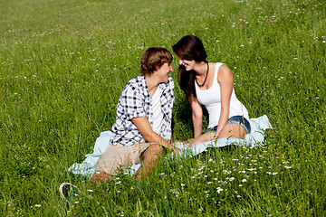 Image showing young couple outdoor in summer on blanket in love