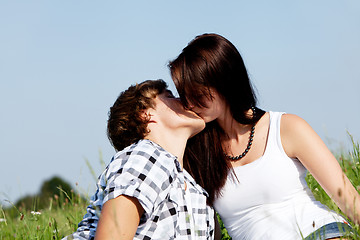 Image showing young couple outdoor in summer on blanket in love