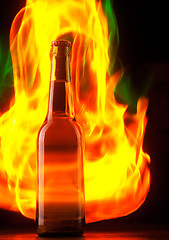 Image showing Beer bottle with color fire