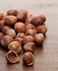 Image showing Nuts at wooden table