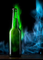 Image showing Beer bottle with color fire