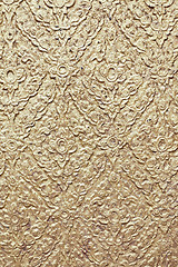 Image showing brown background with golden patterns
