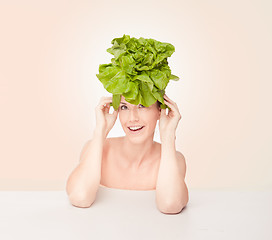 Image showing Fun portrait of a woman wearing a lettuce