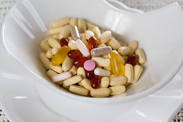 Image showing Vitamins in bowl of tablets