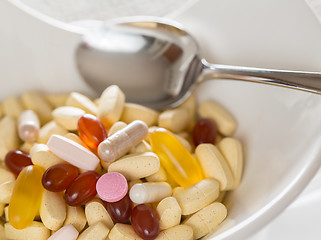 Image showing Vitamins in bowl of tablets