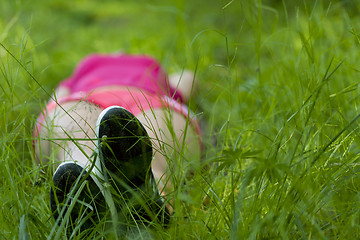 Image showing Girl lying on grass