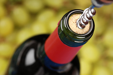 Image showing Opening a wine bottle