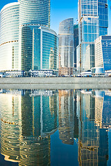 Image showing Business skyscrapers and reflections in the river