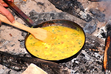 Image showing cooking omelette on camp fire