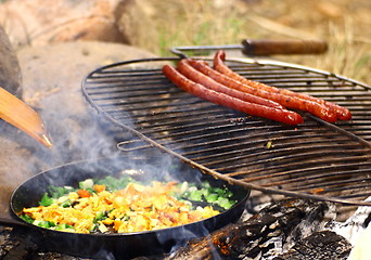 Image showing making omelette outdoor