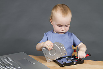 Image showing child repairing open hard drive