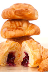 Image showing croissant French brioche filled with berries jam