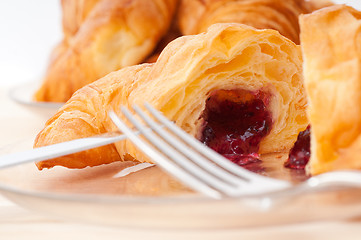 Image showing croissant French brioche filled with berries jam