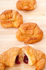 Image showing croissant French brioche filled with berries jam