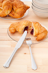 Image showing croissant French brioche filled with berries jam