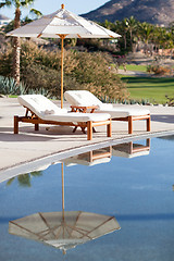 Image showing sunbeds by the pool