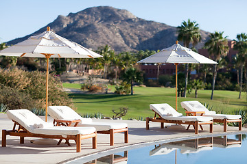 Image showing sunbeds by the pool