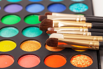 Image showing Set of Multicolored Eyeshadows with Brushes