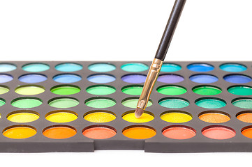 Image showing Set of Multicolored Eyeshadows with Brush