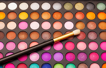 Image showing Set of Multicolored Eyeshadows with Brush