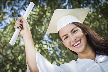 Image showing Graduating Mixed Race Girl In Cap and Gown with Diploma