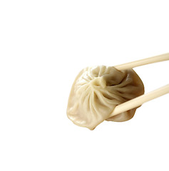 Image showing Ravioli with chopsticks isolated