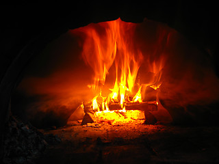 Image showing Fire wood burning in the furnace