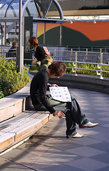 Image showing Man reading a magazine
