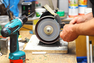 Image showing Man working with sharpening machine tool