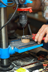 Image showing Man working on drilling machine