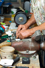 Image showing Senior working in workshop